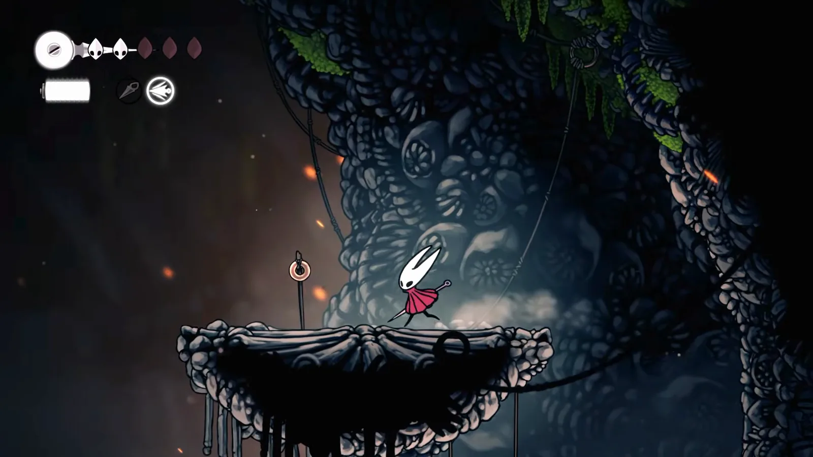 The calling ring on a pole at the far-right ledge above Bone Bottom in Hollow Knight: Silksong, which summons Shakra when struck twice