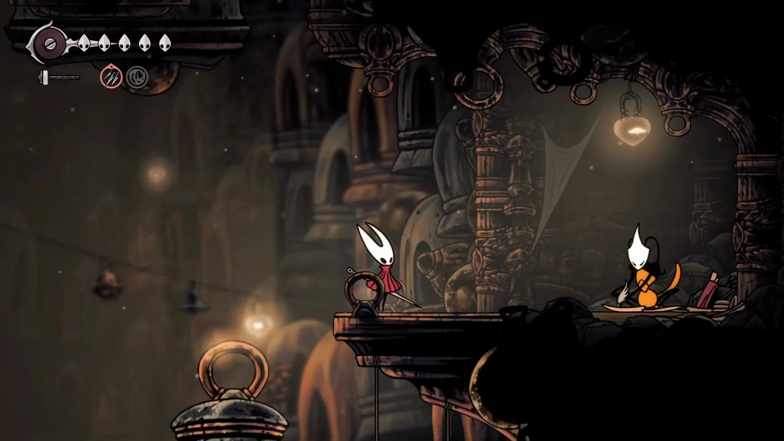 Shakra’s second permanent shop spot inside Bellhart in Hollow Knight: Silksong, with her map scrolls set up beside the hanging lantern