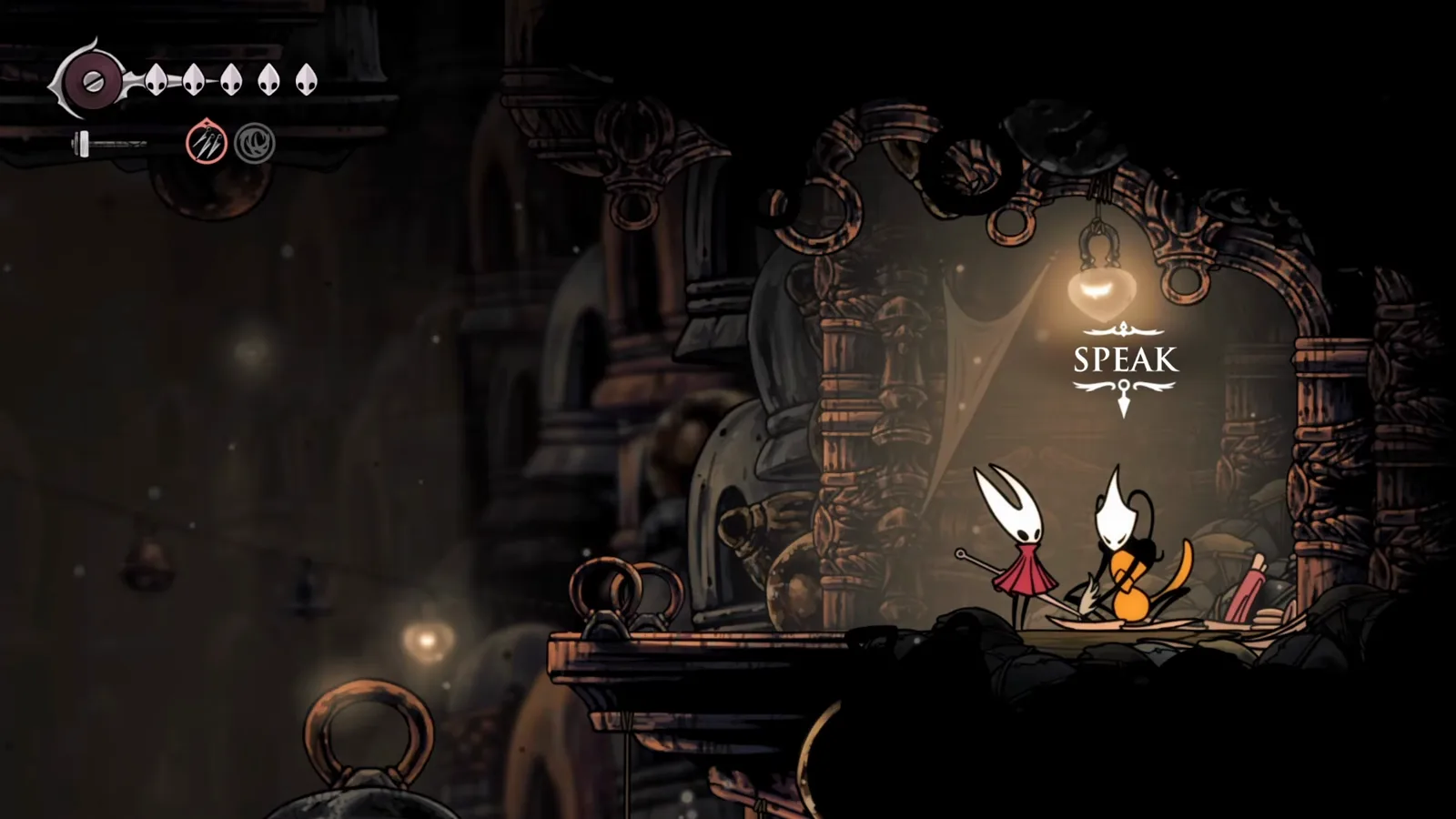 The Speak prompt over Shakra in Bellhart in Hollow Knight: Silksong, opening the map shop after Bone Bottom
